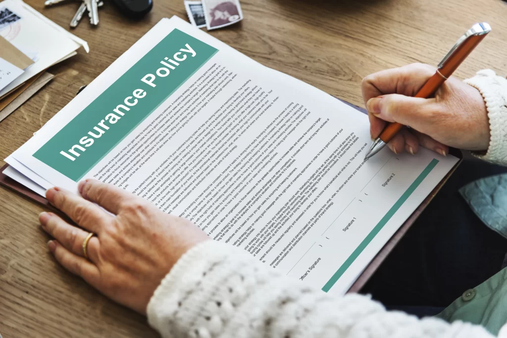 person reviewing insurance policy before renewal in the Philippines