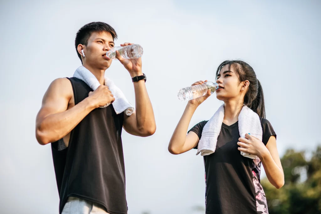 Family staying hydrated and protected from heat during El Niño in the Philippines
